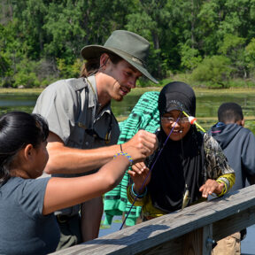 Guide teaching kids to fish